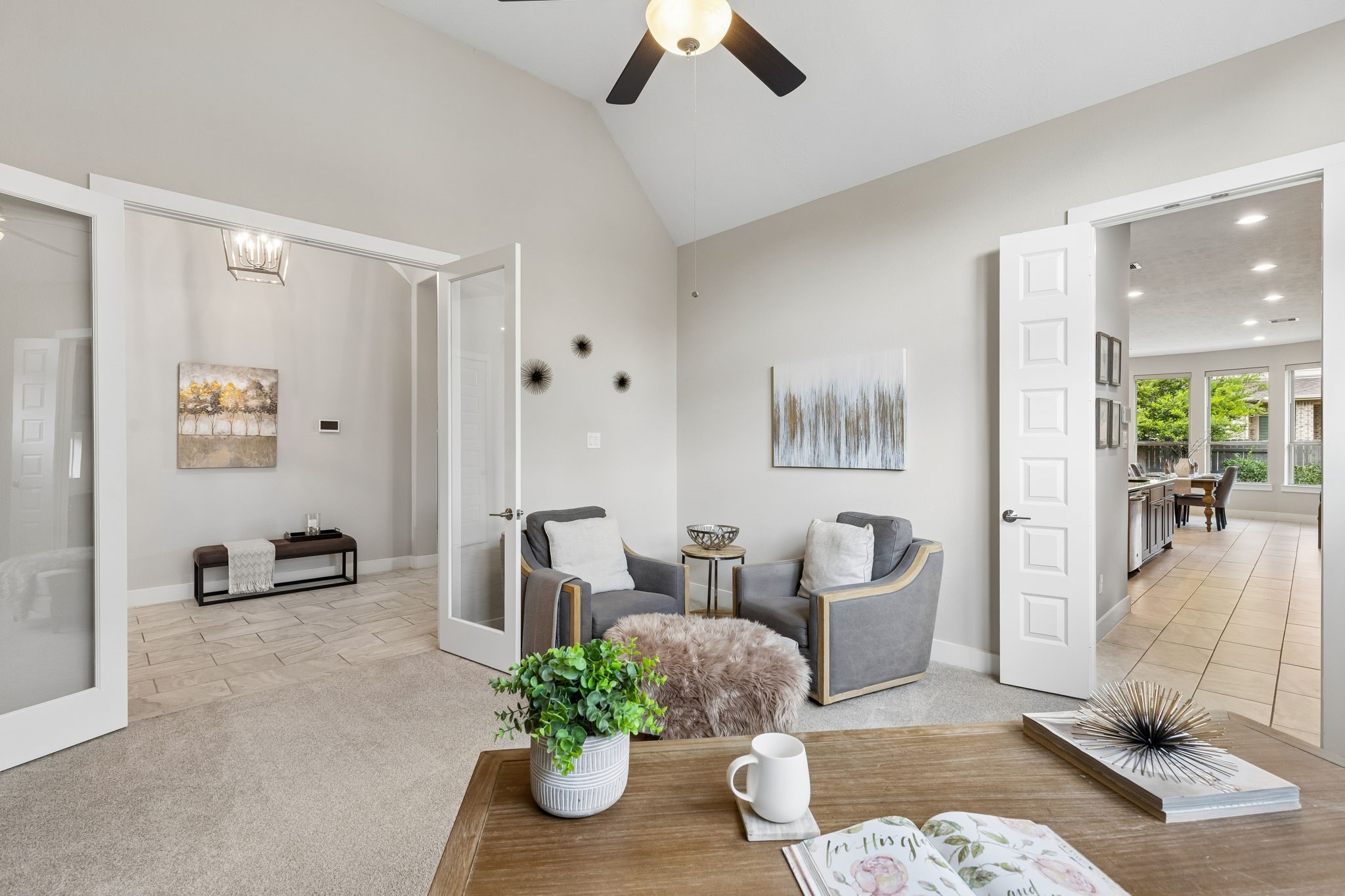 6514 Woodleaf Lake Loop Katy, TX 77493 - Photo 12 of 32 From this perspective, the room beautifully showcases its seamless connection to the home’s main living areas, highlighting the fluid open-concept design of this one-story home.