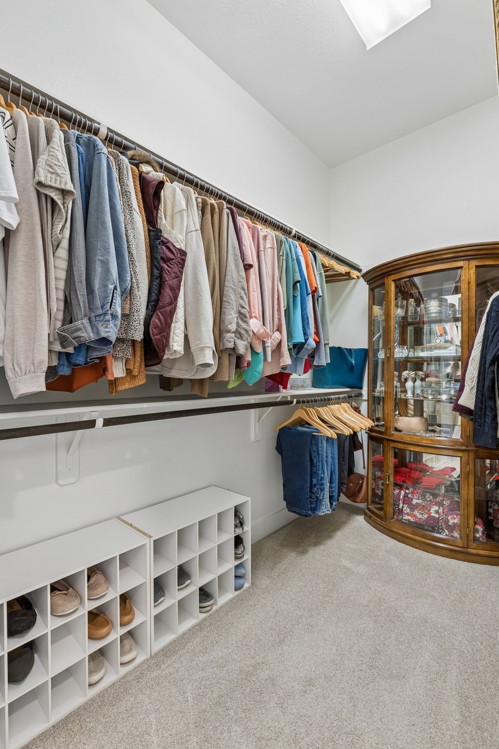 6514 Woodleaf Lake Loop Katy, TX 77493 - Photo 15 of 32 The primary suite includes dual walk-in closets featuring extensive built-in shelving, shoe racks, and abundant storage space.