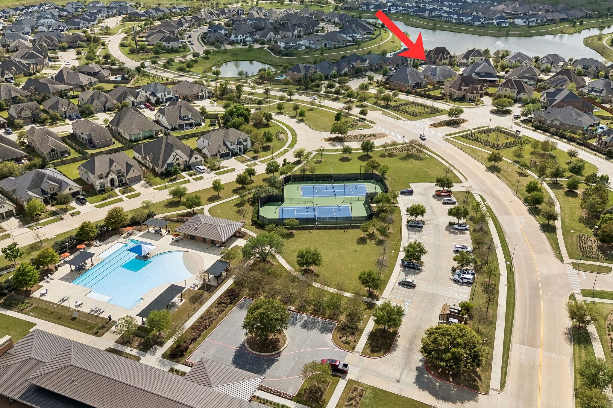 6514 Woodleaf Lake Loop Katy, TX 77493 - Photo 25 of 32 This aerial overview illustrates the estate's premier location within Elyson, situated just a short walk from the community's world-class recreational facilities such as the resort-style pool and professional tennis courts.