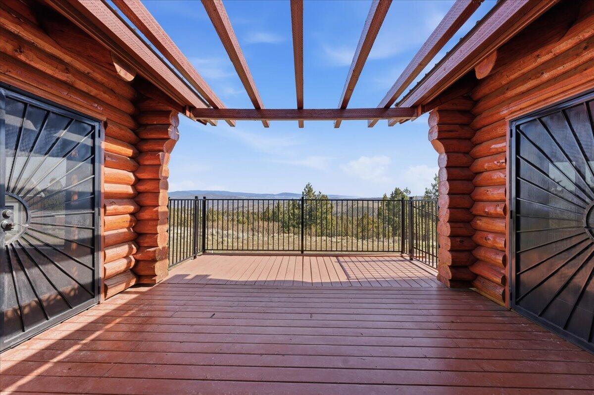 19554 Osprey Road Prineville, OR 97754 - Photo 7 of 42 back deck and off Front entrance and access from primary and great room.
