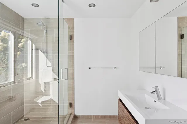 a bathroom with a bathtub and a shower