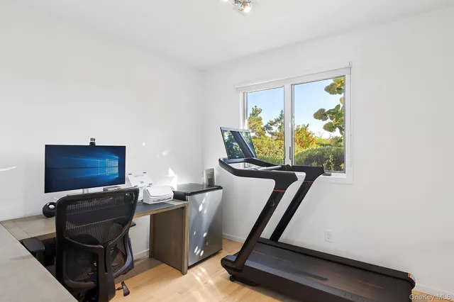 a room with furniture and a flat screen tv