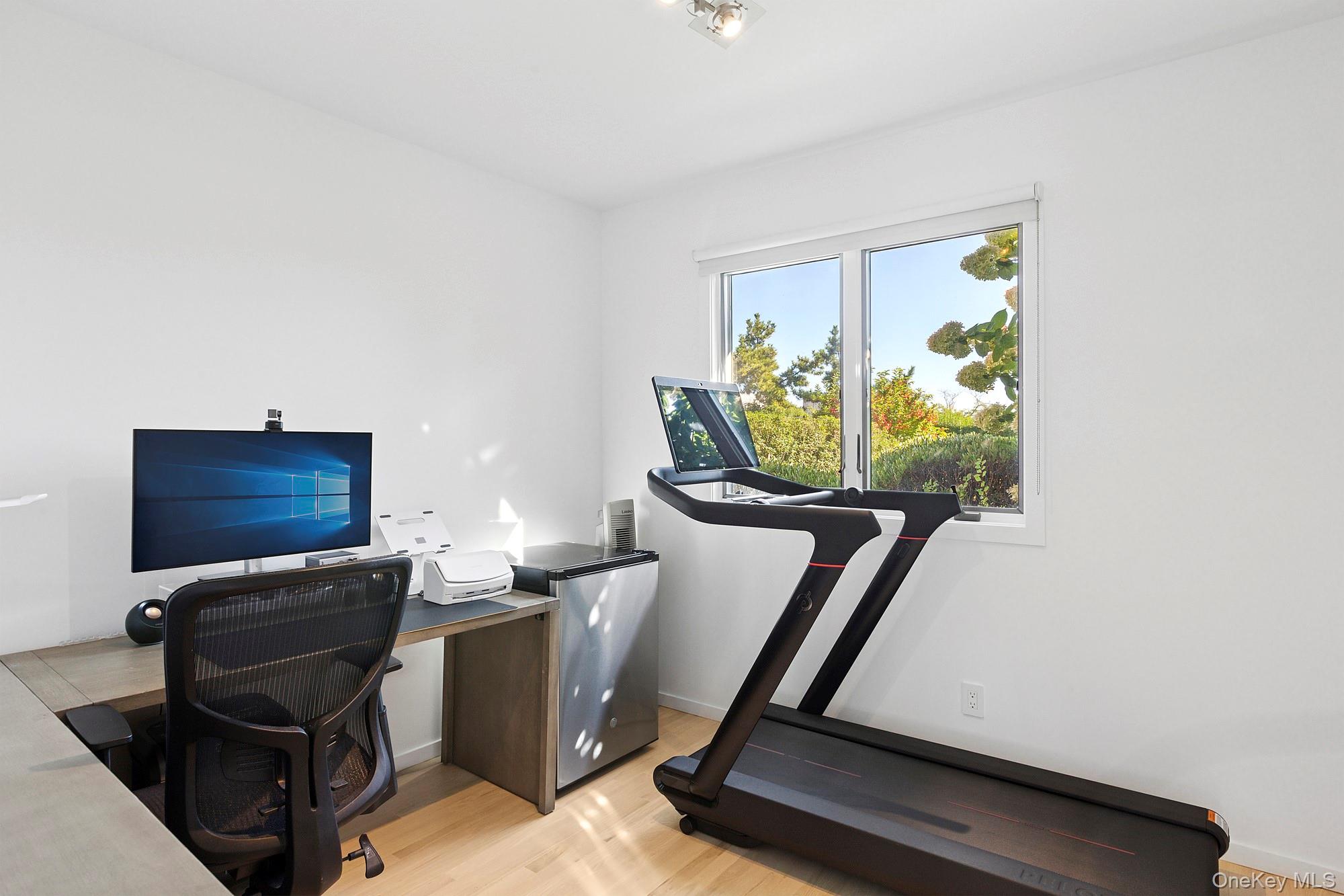 4 Bayberry Lane Remsenburg, NY 11960 - Photo 16 of 27 a room with furniture and a flat screen tv