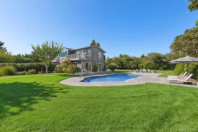 a view of a house with swimming pool yard and patio