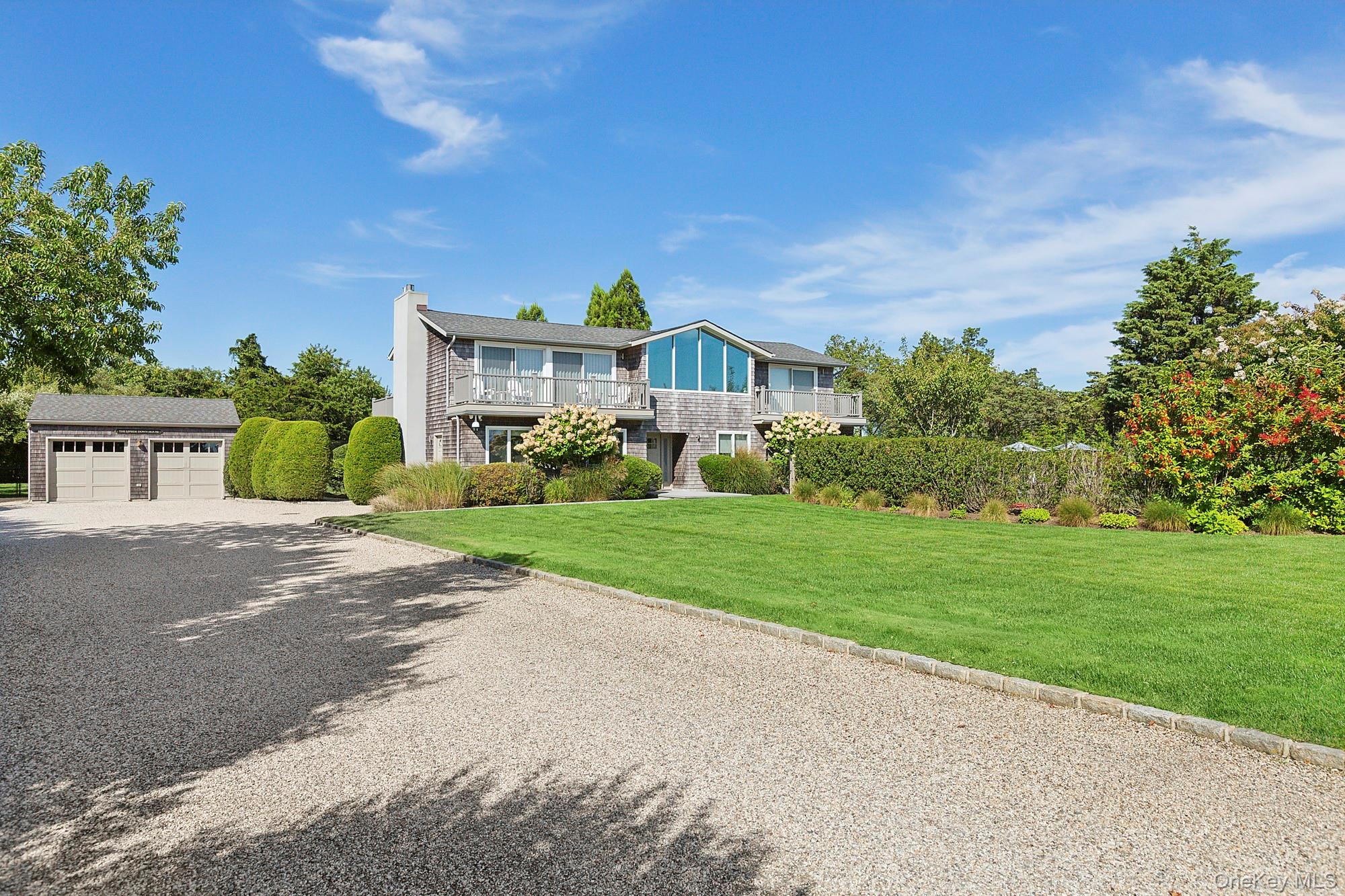 4 Bayberry Lane Remsenburg, NY 11960 - Photo 24 of 27 a front view of house with yard and green space