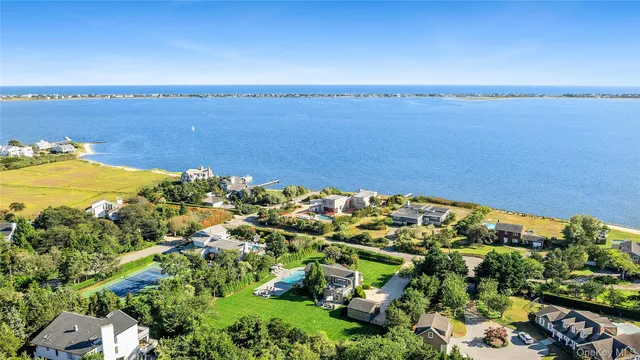 a view of a large body of water with a building in the background