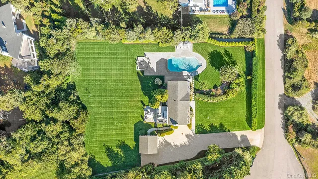 a view of a house with a fountain back yard