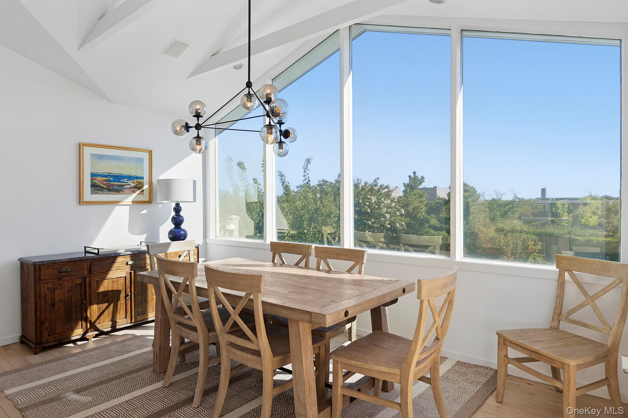 4 Bayberry Lane Remsenburg, NY 11960 - Photo 6 of 27 a view of a dining room with furniture window and outside view