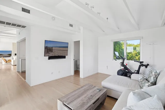 a living room with furniture and a window