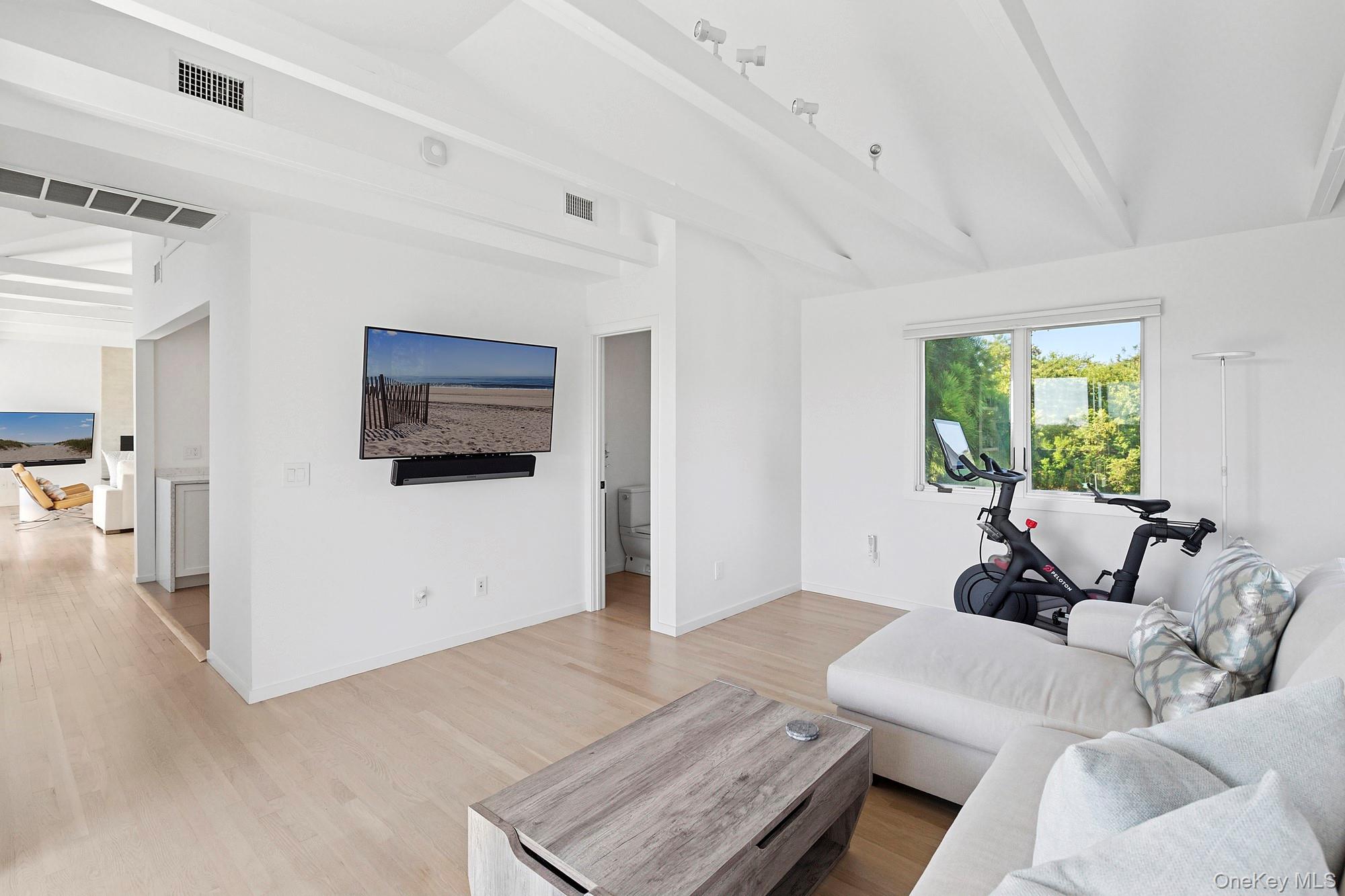 4 Bayberry Lane Remsenburg, NY 11960 - Photo 7 of 27 a living room with furniture and a window