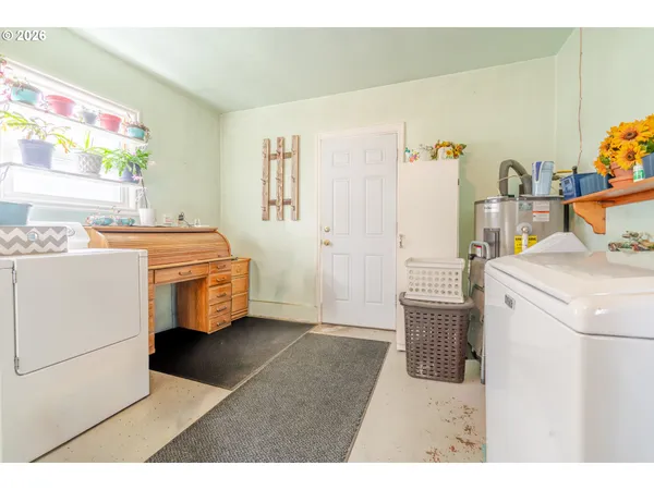 a kitchen with a stove and a refrigerator