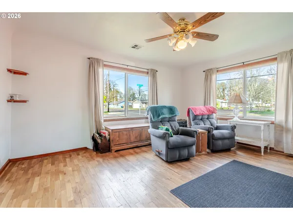 a living room with furniture and windows