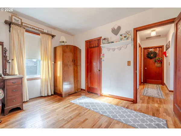 a view of a livingroom with wooden floor and closet