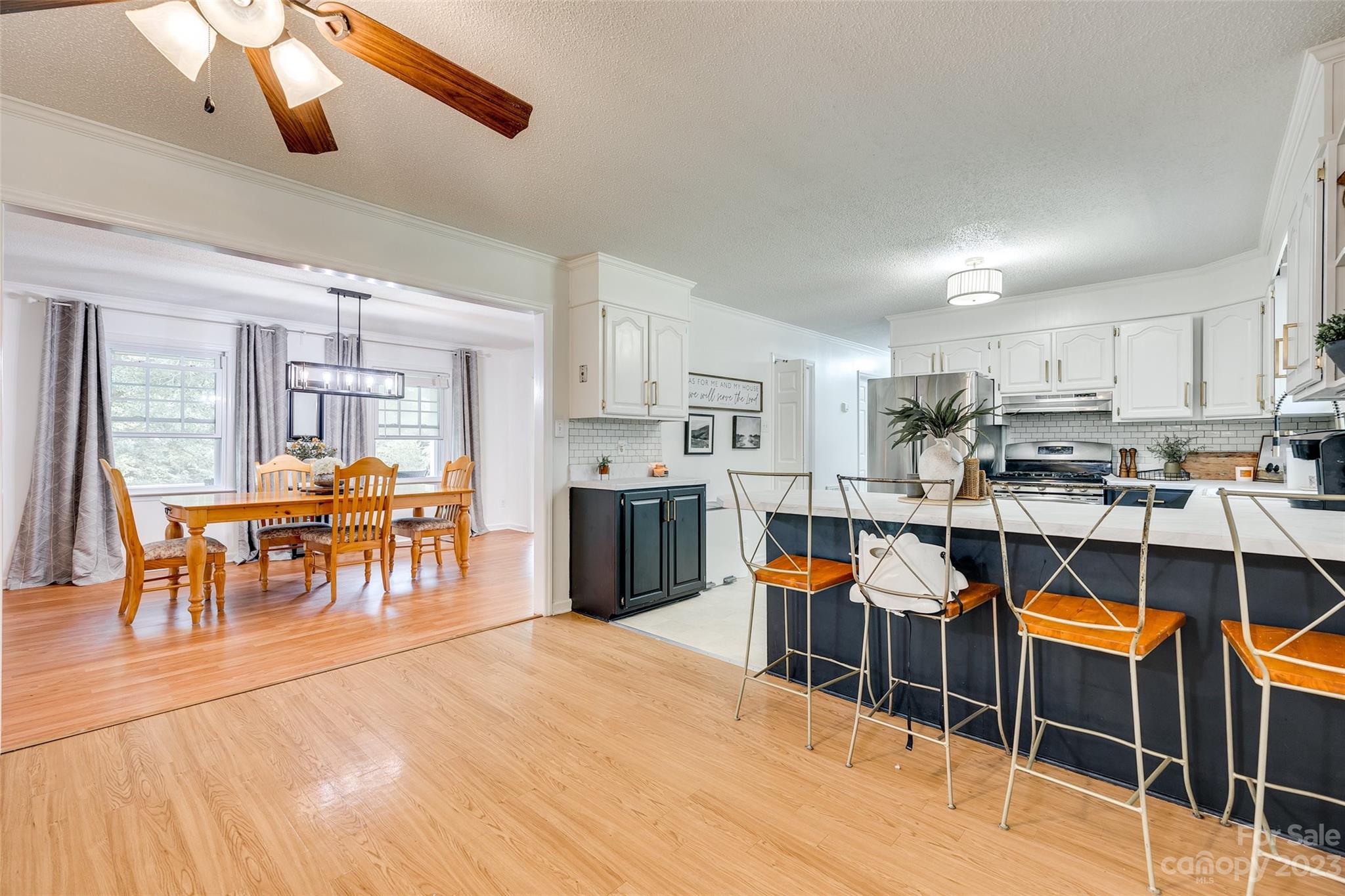 377 Rainbow Circle Clover, SC 29710 - Photo 13 of 29 a room with stainless steel appliances kitchen island granite countertop furniture and a dining table