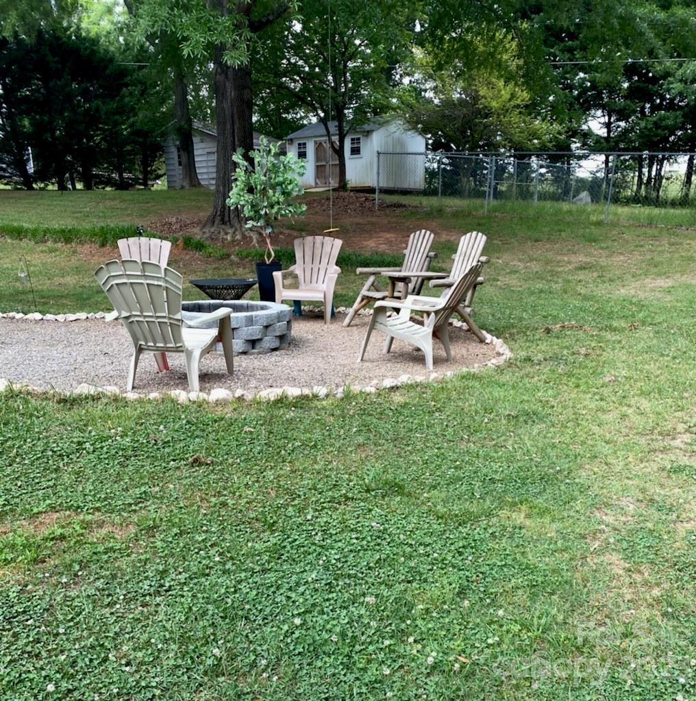377 Rainbow Circle Clover, SC 29710 - Photo 26 of 29 a view of a chair and table in the garden
