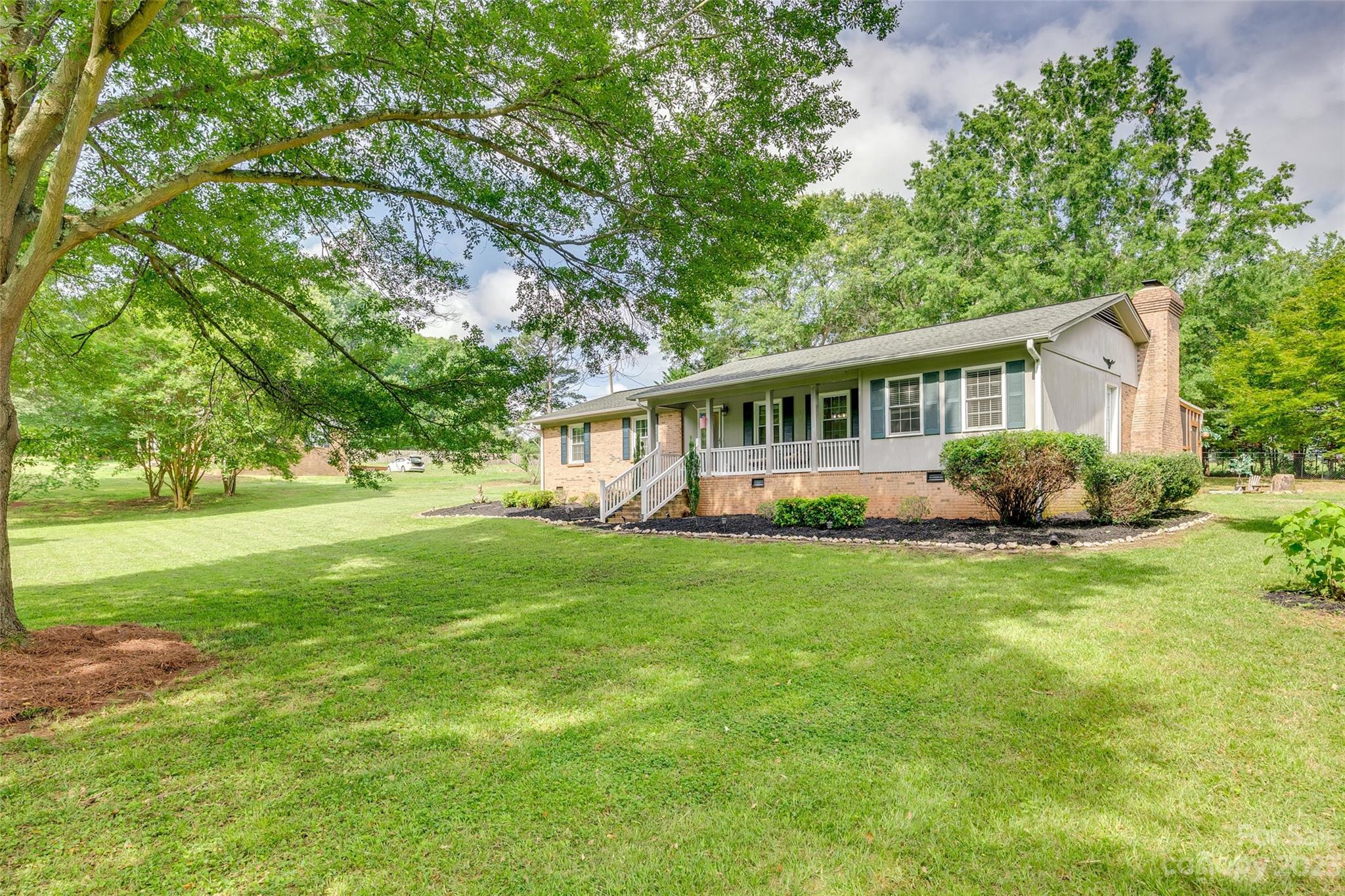 377 Rainbow Circle Clover, SC 29710 - Photo 4 of 29 a view of a house with backyard and garden