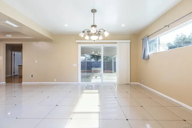 a view of an empty room with glass door