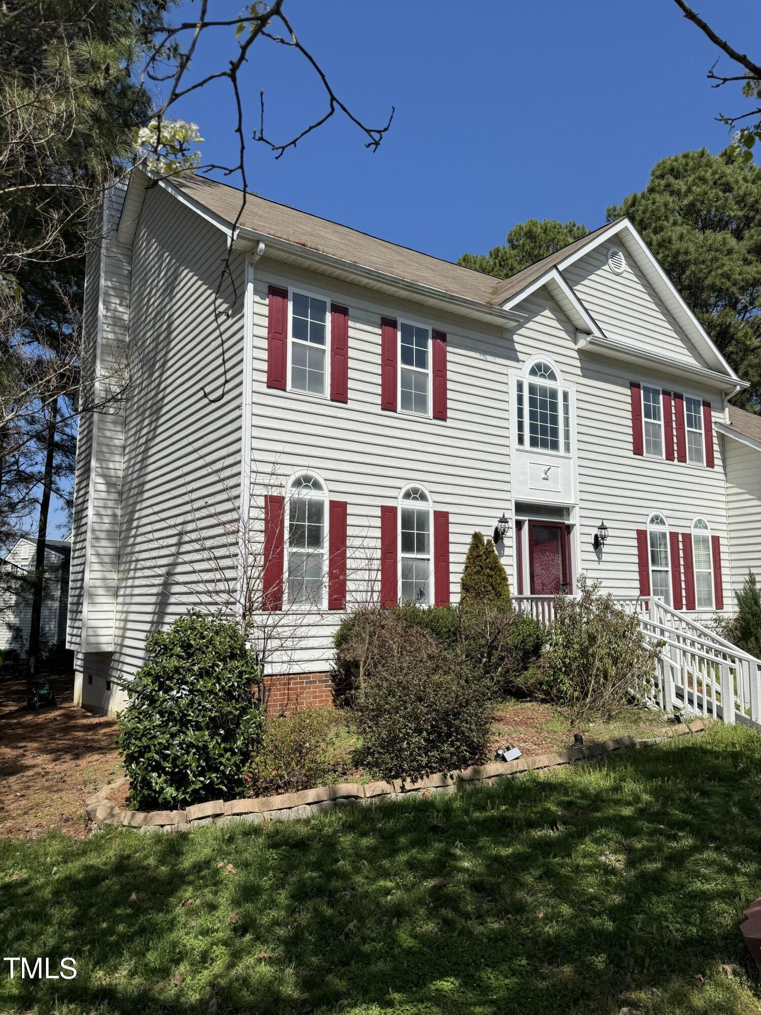 4809 Arbor Chase Drive Raleigh, NC 27616 - Photo 4 of 10 a front view of a house with a yard