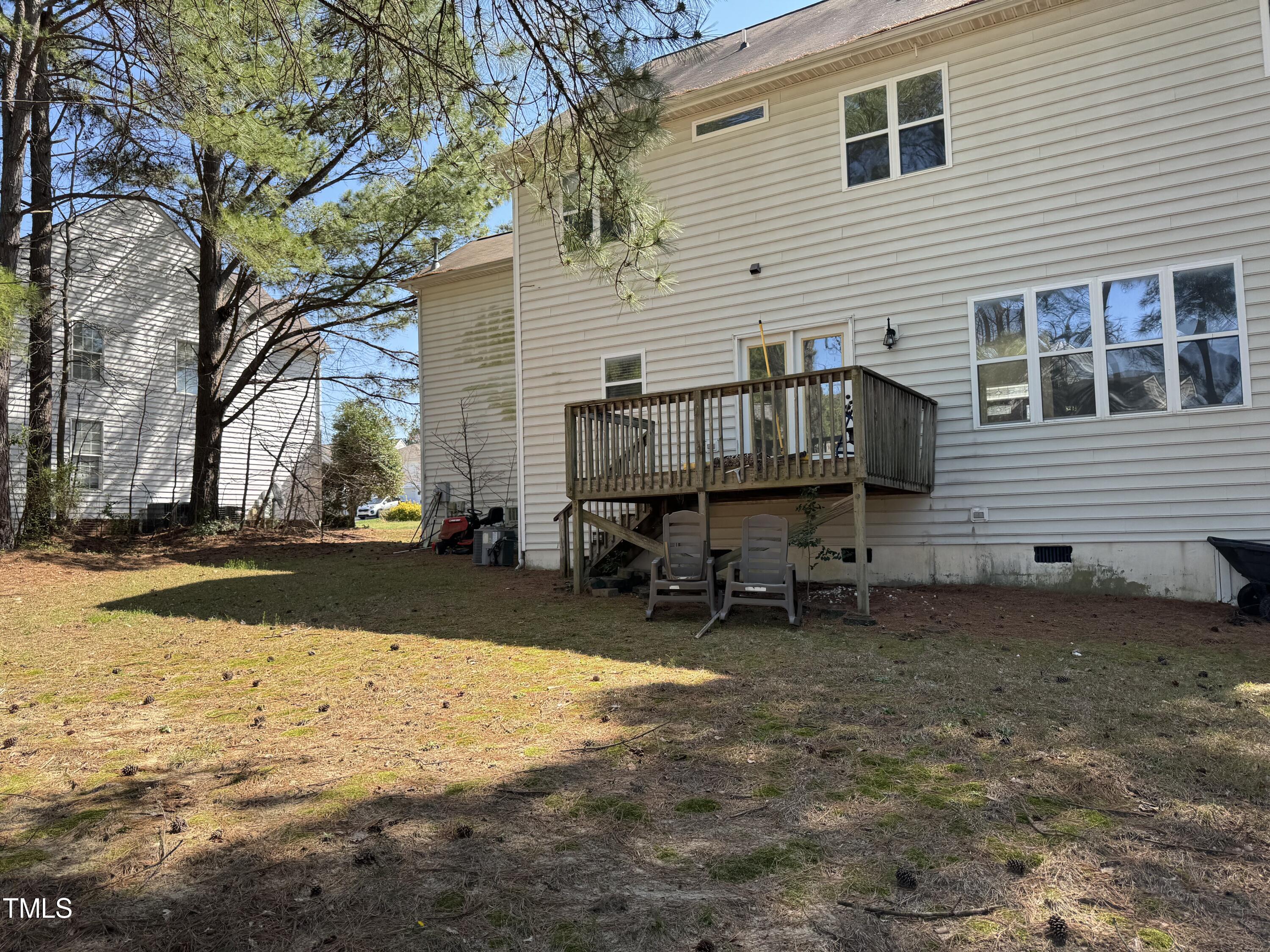 4809 Arbor Chase Drive Raleigh, NC 27616 - Photo 6 of 10 a view of a house with a yard and a tree