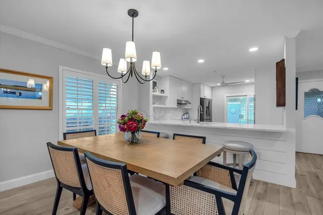 a kitchen with a table and chairs in it