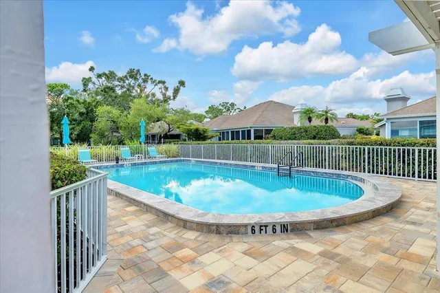 a view of a chair and tables in the roof deck