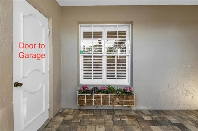 a view of hallway with wooden floor and stairs