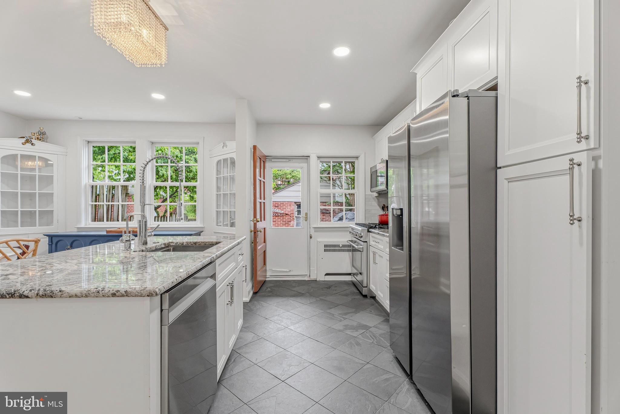 314 Murdock Road Baltimore, MD 21212 - Photo 9 of 42 a kitchen with stainless steel appliances granite countertop a refrigerator and a sink
