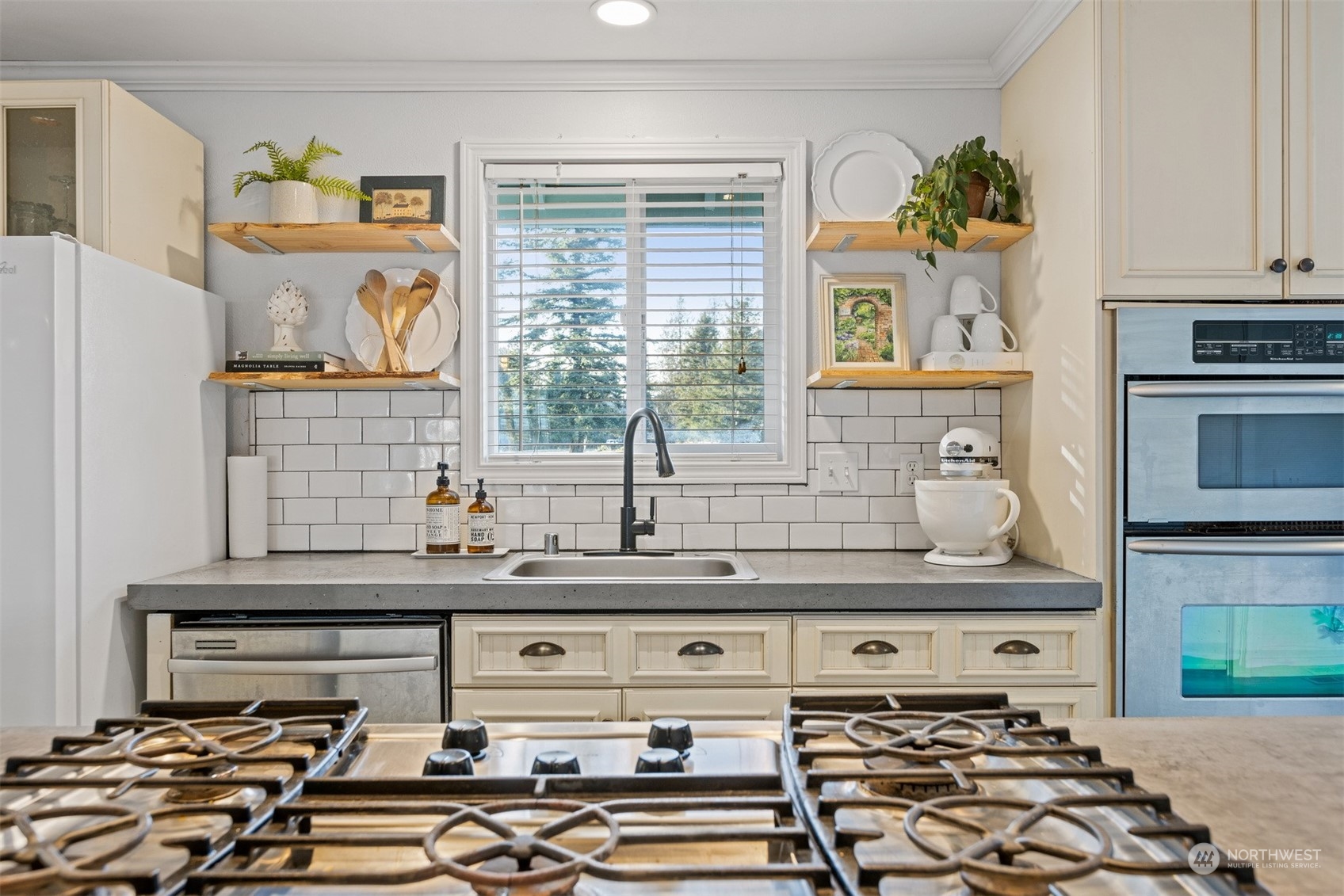7379 Hannegan Road Lynden, WA 98264 - Photo 17 of 32 a kitchen with a stove a sink and a microwave