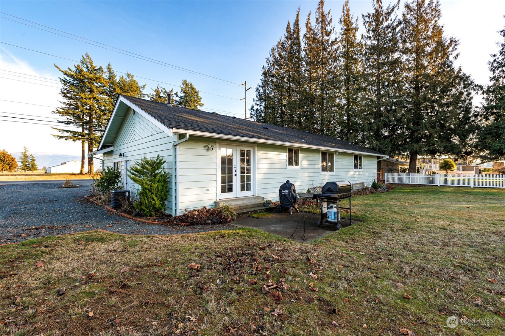 7379 Hannegan Road Lynden, WA 98264 - Photo 6 of 32 a view of a house with a patio