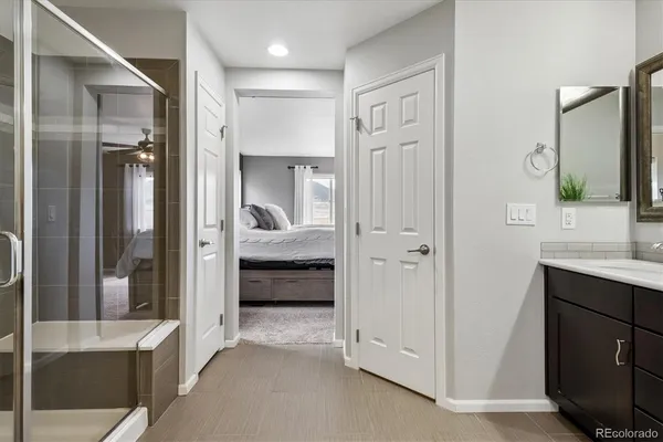 a view of a bathroom with tub and mirror