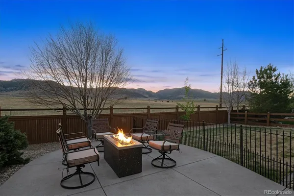a view of a lake with a bench in a patio