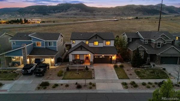 a aerial view of a house with a lake view