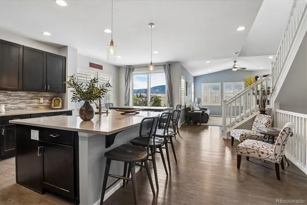 a kitchen with lots of counter space dining table and chairs