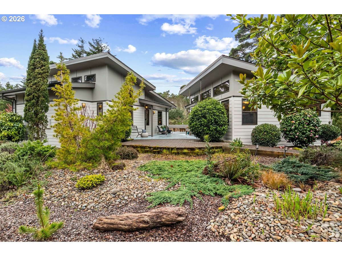 4975 Heceta Beach Road Florence, OR 97439 - Photo 1 of 48 a house view with a garden space
