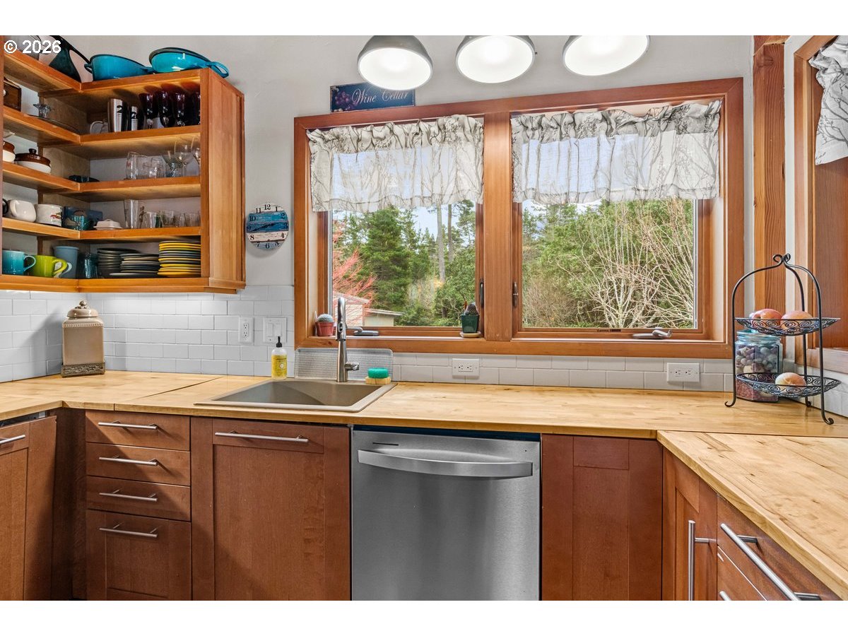 4975 Heceta Beach Road Florence, OR 97439 - Photo 15 of 48 a kitchen with a sink and a large window