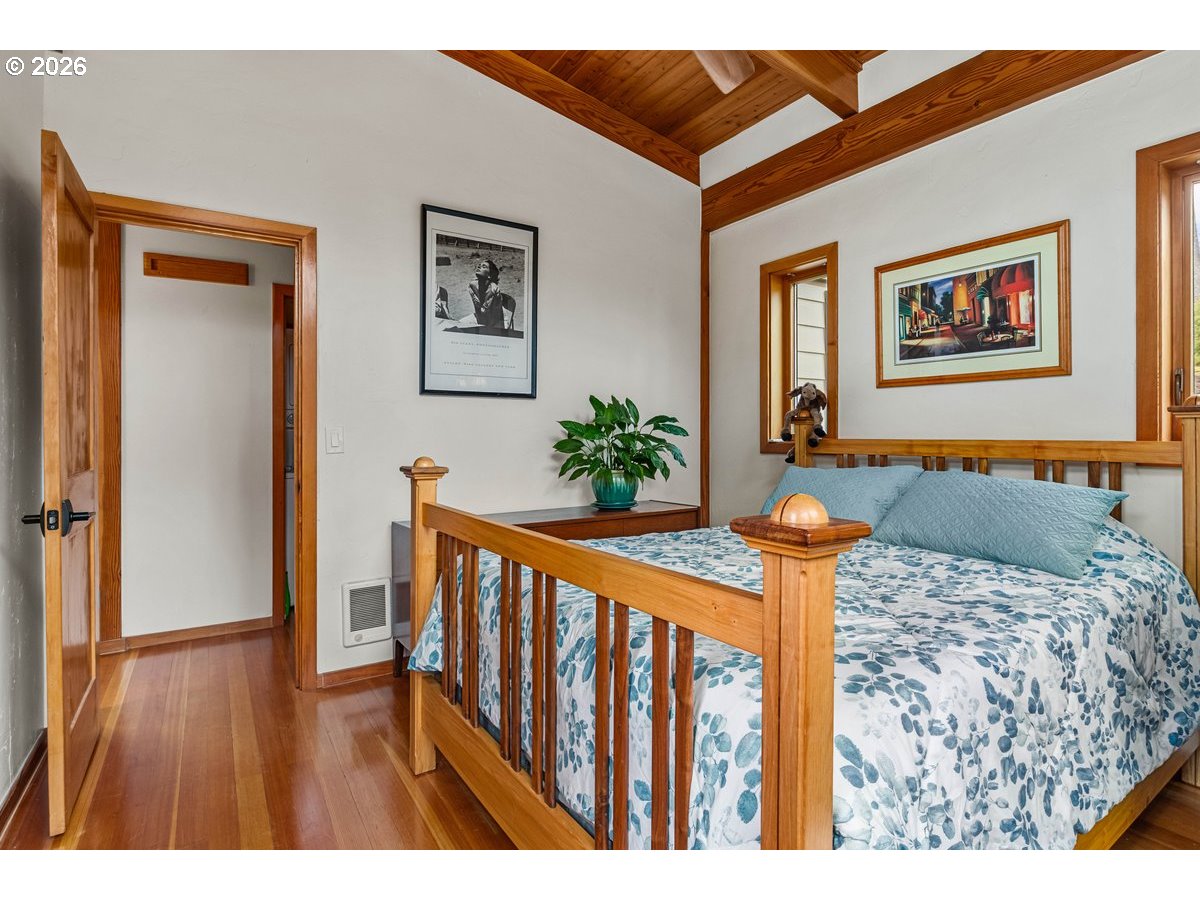 4975 Heceta Beach Road Florence, OR 97439 - Photo 21 of 48 a bedroom with furniture and wooden floor