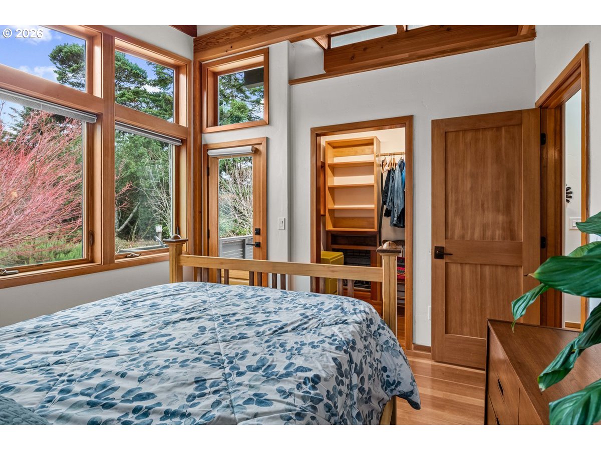 4975 Heceta Beach Road Florence, OR 97439 - Photo 23 of 48 a bedroom with a bed and a window