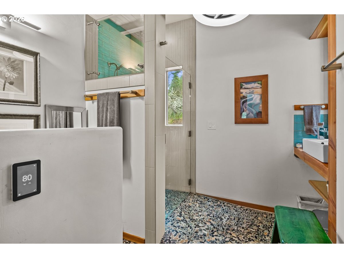 4975 Heceta Beach Road Florence, OR 97439 - Photo 25 of 48 a view of a hallway with a bookshelf