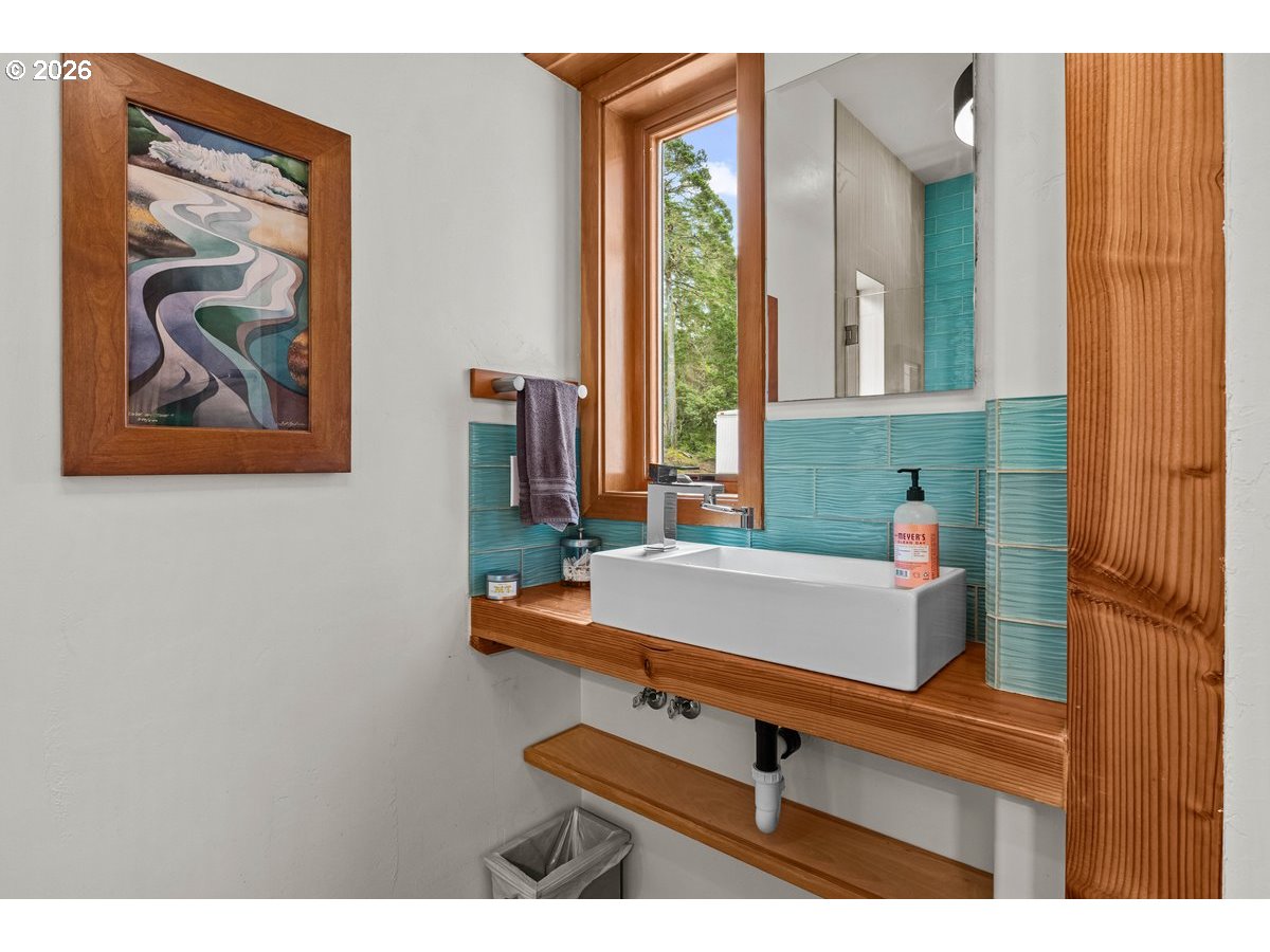 4975 Heceta Beach Road Florence, OR 97439 - Photo 26 of 48 a bathroom with a sink and a mirror