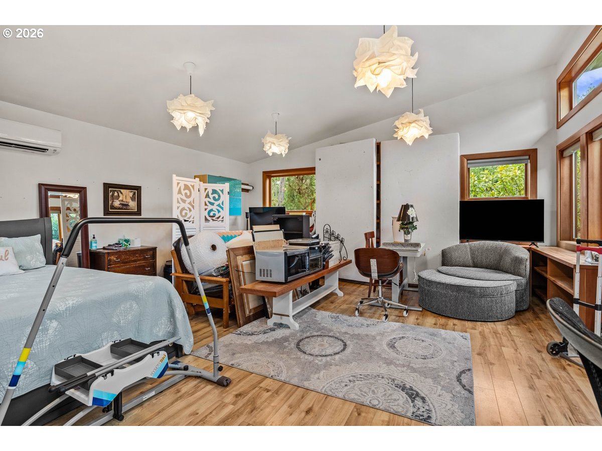 4975 Heceta Beach Road Florence, OR 97439 - Photo 33 of 48 a living room with furniture and a flat screen tv