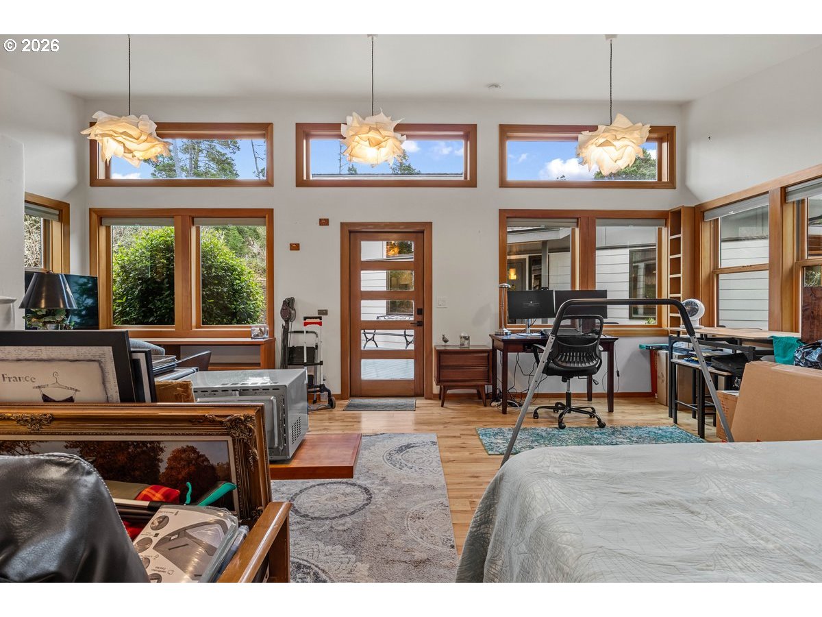 4975 Heceta Beach Road Florence, OR 97439 - Photo 34 of 48 a living room with furniture a flat screen tv and outdoor view
