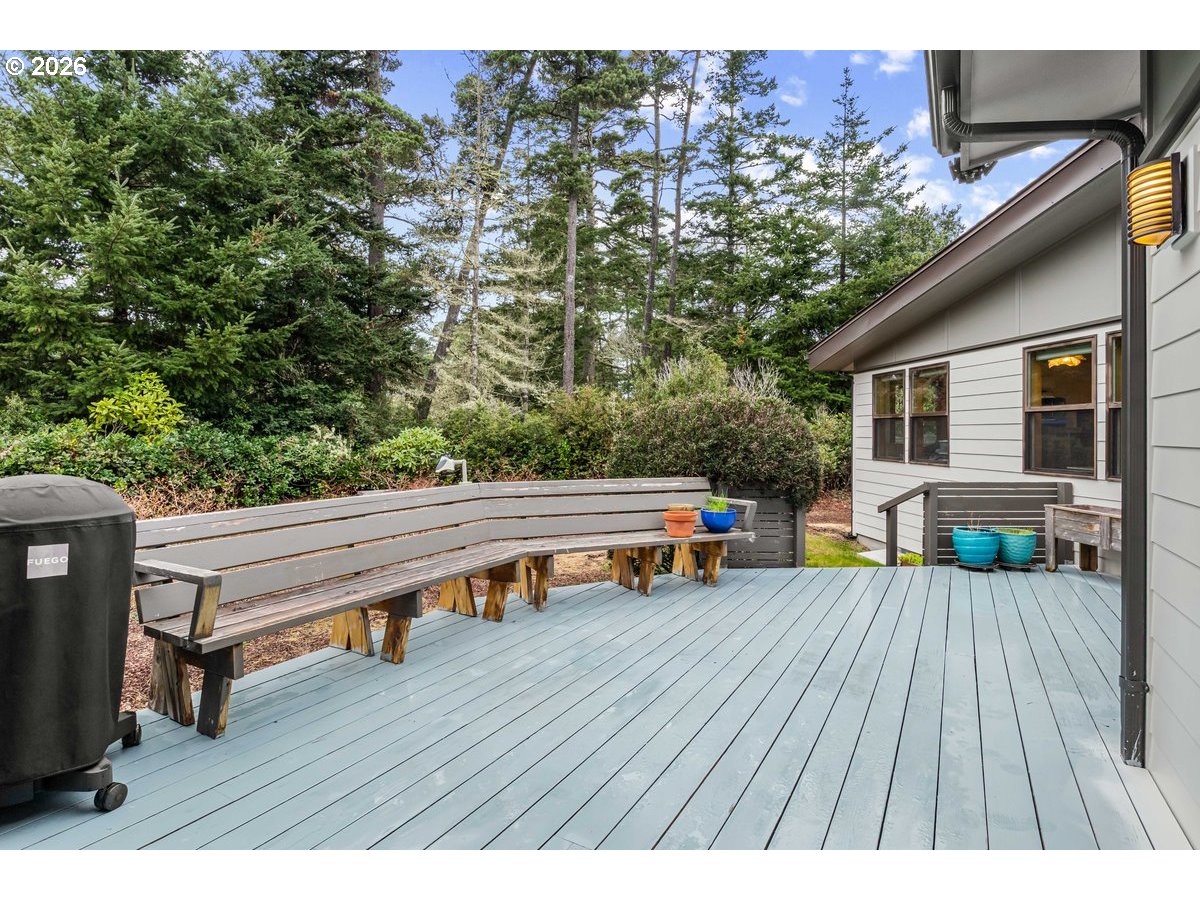 4975 Heceta Beach Road Florence, OR 97439 - Photo 40 of 48 a view of a chairs and table on the wooden deck