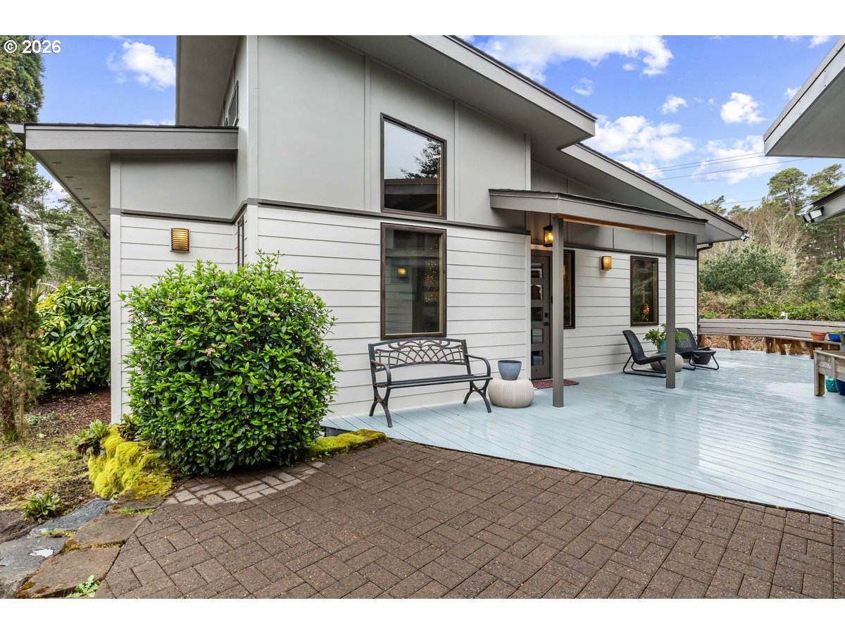 4975 Heceta Beach Road Florence, OR 97439 - Photo 4 of 48 a view of a house with a patio