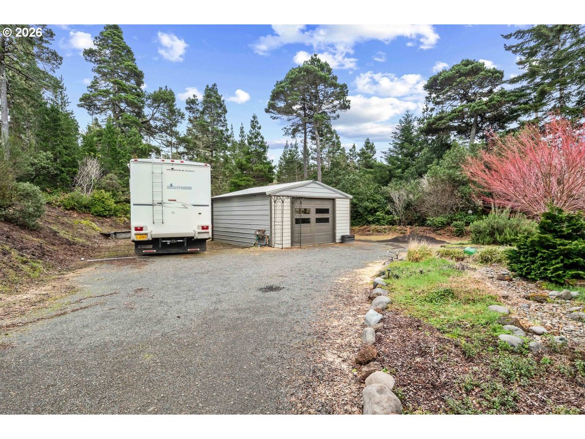 4975 Heceta Beach Road Florence, OR 97439 - Photo 43 of 48 a house view with a garden