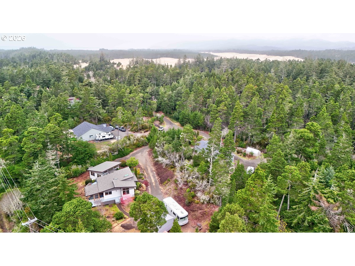 4975 Heceta Beach Road Florence, OR 97439 - Photo 46 of 48 an aerial view of a house with a yard