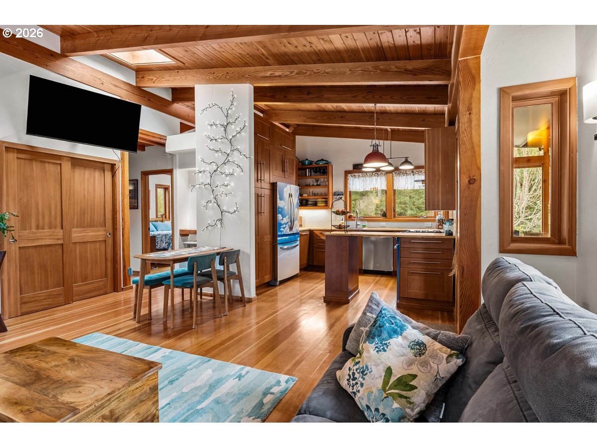 4975 Heceta Beach Road Florence, OR 97439 - Photo 10 of 48 a living room with furniture and a flat screen tv