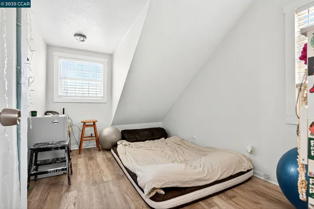 a bedroom with a bed and a closet