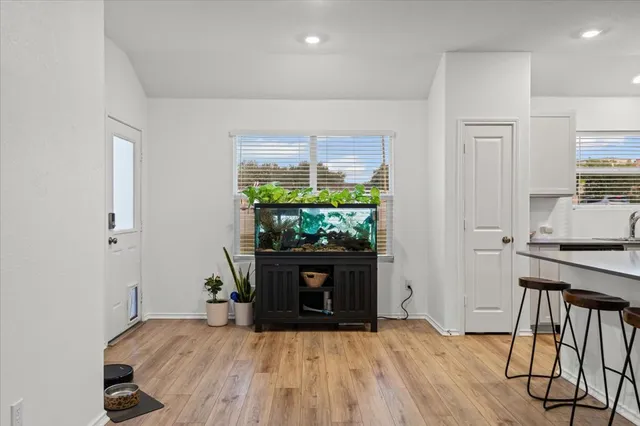 a room with a fireplace and a window