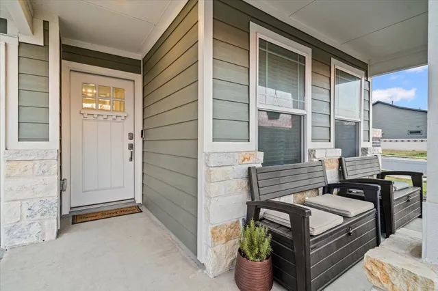 a view of outdoor seating and kitchen