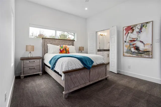 a bed room with a bed and a window